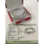 A CHINESE JADE BANGLE WITH CERTIFICATE OF AUTHENTICITY [8CM IN DIAMETER]