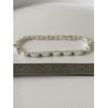 A Silver opal and emerald line bracelet [18.5cm in length]