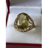 A 9ct gold ladies ring set with a large yellow tone cut stone [size Q] [5.46g]