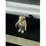 A Silver penguin pincushion with glass eyes. [2.9cm in height]