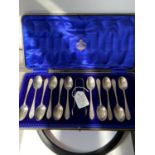 A boxed set of 11 Sheffield silver teaspoons & sugar tongs produced [Sutherland & Roden] [188g]