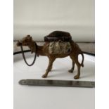 A Cold painted bronze camel pincushion. [7.5x10.5x3.5cm] [193.90grams]