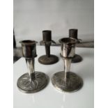 A Pair of Malaysian silver candle sticks together with a pair of plated candle sticks. [8cm in