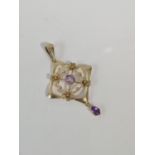 A 9CT GOLD AND AMETHYST FOLIATE PENDANT, CIRCA 1900. SEE IMAGES FOR MORE DETAILS.