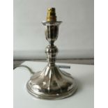 A 830 Silver candle stick modified into a table lamp. [17.5cm in height]