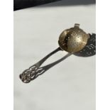 A Sheffield silver tea strainer [Walker & Hall] [dated,1959] [length 15cm] [51g]