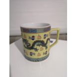 A CHINESE YELLOW GROUND DRAGON DESIGN MUG. -[10CM IN HEIGHT]