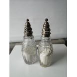 Two silver top & glass body sugar shakers [16cm in height]