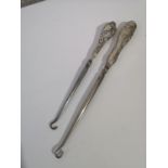 TWO SILVER HANDLE BUTTON HOOKS. SNYDER & BEDDOES DATED 1902 AND OTHER MARKS ARE RUBBED TO THE