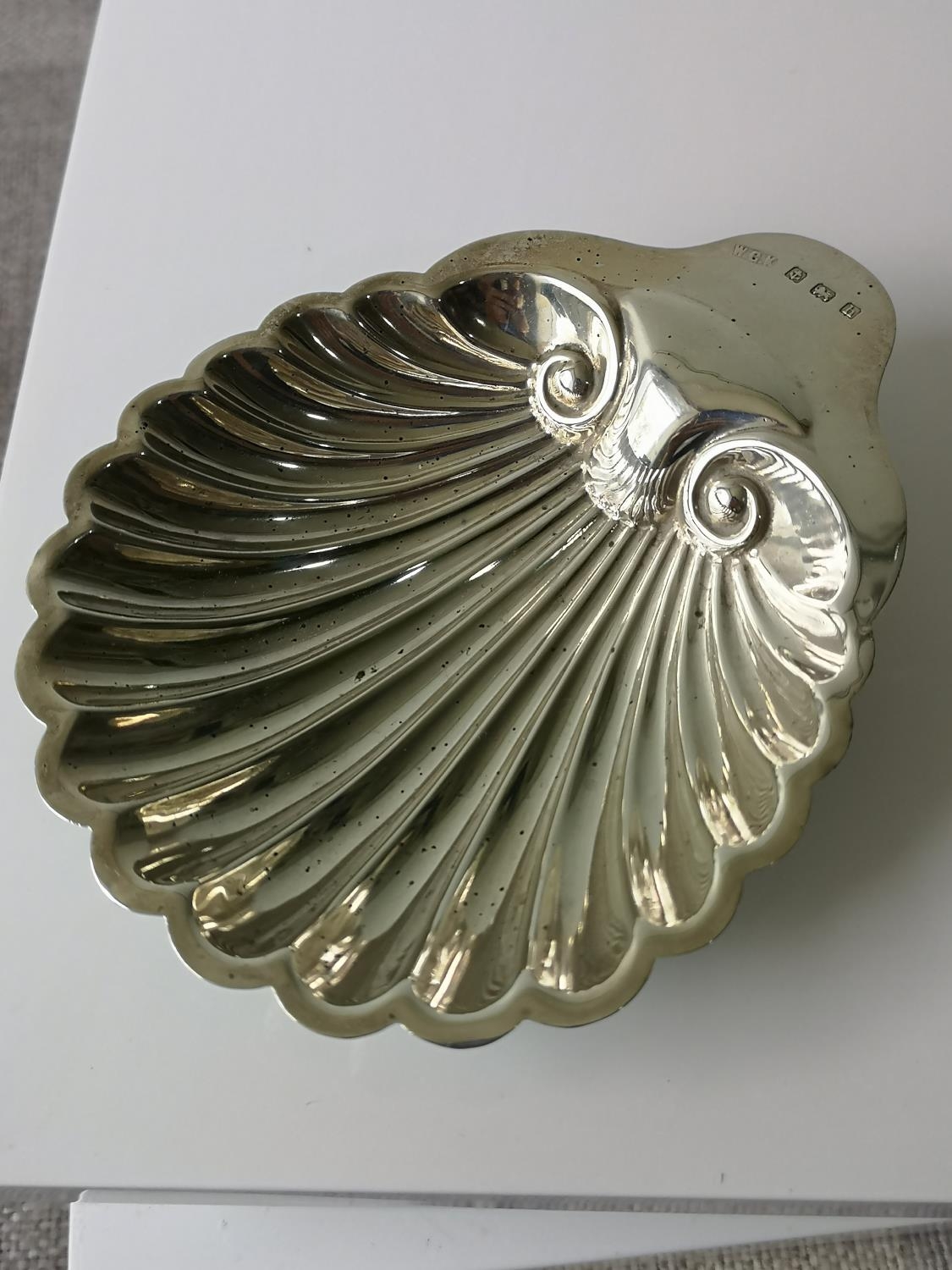 A Birmingham silver Scallop shaped pin dish sat upon three bun supports. Maker W. G. K. [59.62GRAMS]