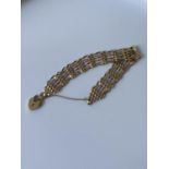 A 9ct gold gate bracelet [6.70g]