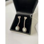 A Pair of silver, CZ and opal drop earrings. [3.5cm in length]