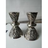 A Pair of Thailand Sterling silver candle holders in an ornate form. [11cm in height] [756grams]