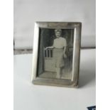 A Small Sheffield silver photo frame with a blue velvet backing. Produced by Carr's of Sheffield