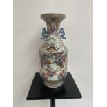 A LARGE 19TH CENTURY CHINESE FAMILLE ROSE VASE. The large vase with rich illustrations depicting