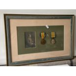 A Framed WWI War & Victory medals with photograph of officer. Medals belong to 74571 PTE. J. E. P.