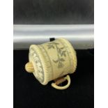 An unusual oriental bone tape measure with etched decoration. [5.5cm in length]