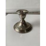 A London silver dwarf candlestick, with a weighted base [height 7cm]