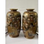 A pair of Japanese satsuma hand painted vases depicting various characters & dragon design [height