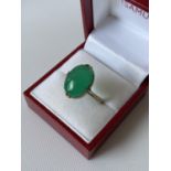 A 9ct gold ladies green stone ring [size R] [3.19g]