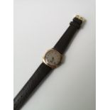 A Vintage London 9ct gold cased Mens watch. In a working condition.