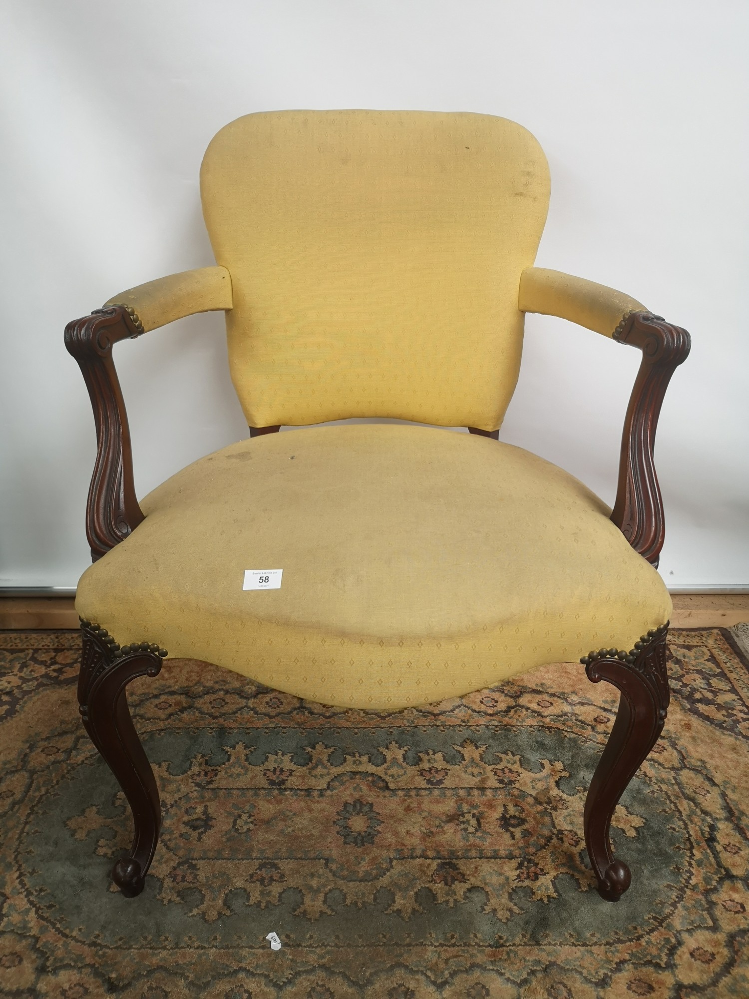 A Victorian arm chair, open scroll arms, supported on cabriole legs and ending in scroll feet [ - Image 2 of 4