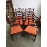 A set of six early 19th century dining chairs (two carvers), with pierced top rails and ladder