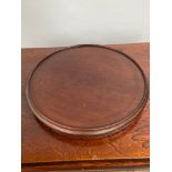 A 19th century mahogany lazy susie. [38cm in diameter]