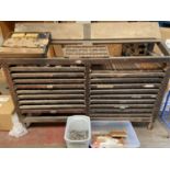 A vintage industrial multi-drawer newspaper press unit, together with various lead lettering [141