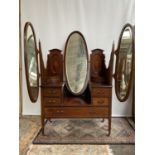 A Late Victorian/ early Edwardian five drawer dressing table chest, Designed with centre mirror