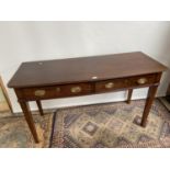 A Georgian two drawer console table supported on square tapered legs. [79x140x55cm]