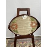 A 19th century mahogany framed serving tray, with glass encased floral tapestry [length, 58cm]
