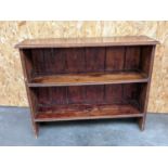 A stained pine two tier bookshelf [height, 77cm, length, 96cm, width, 27cm]