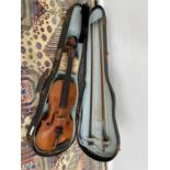 An antique violin, with two bows and carry case