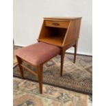 A Mid century teak 'Chippy' pull out telephone seat/ table.