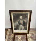 An early 19th century coloured engraving print of Lord Nelson, within a dark wood and gilt painted