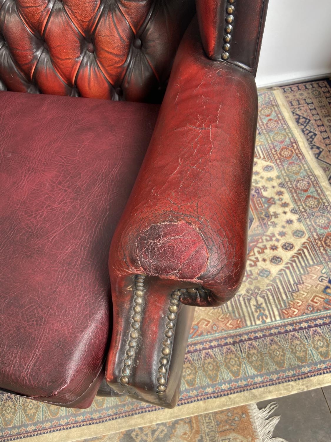Antique chesterfield oxblood red gull wing arm chair. [107cm in height] - Image 2 of 7