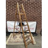 A set of vintage wooden ladders