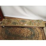 A Victorian fireside stool, upholstered with a foliage and floral tapestry design [length, 126cm,