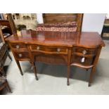 Georgian Style Mahogany Serpentine sideboard. A Serpentine top above a central frieze drawer and