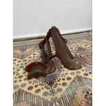 Victorian, Belfast made cast iron and mahogany saddle rack, together with a reign mount