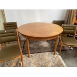 A Stylish retro mid century teak table and six matching chairs. Possibly by McIntosh of
