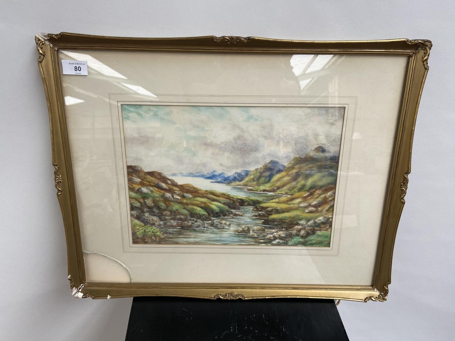 An early 20th century watercolour depicting a mountain and river landscape scene by J.C. Gray of