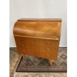 A Retro mid century Swedish made barrel top writing bureau. Designed with three drawers and