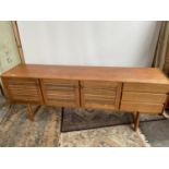 A Mid century Retro teak sideboard produced by A.H. McIntosh of Kirkcaldy. [77x200x45cm]