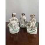 A Lot of three antique Staffordshire seated figurines [15cm in height]