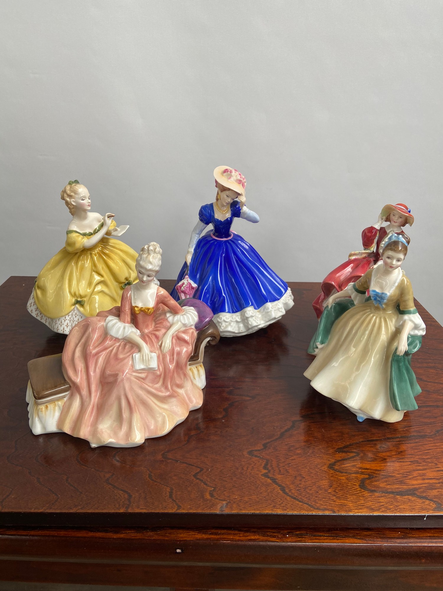 A lot of five Royal Doulton figurines; 'Mary', 'Top O' The Hill', 'Elegance', 'The Last Waltz' & '