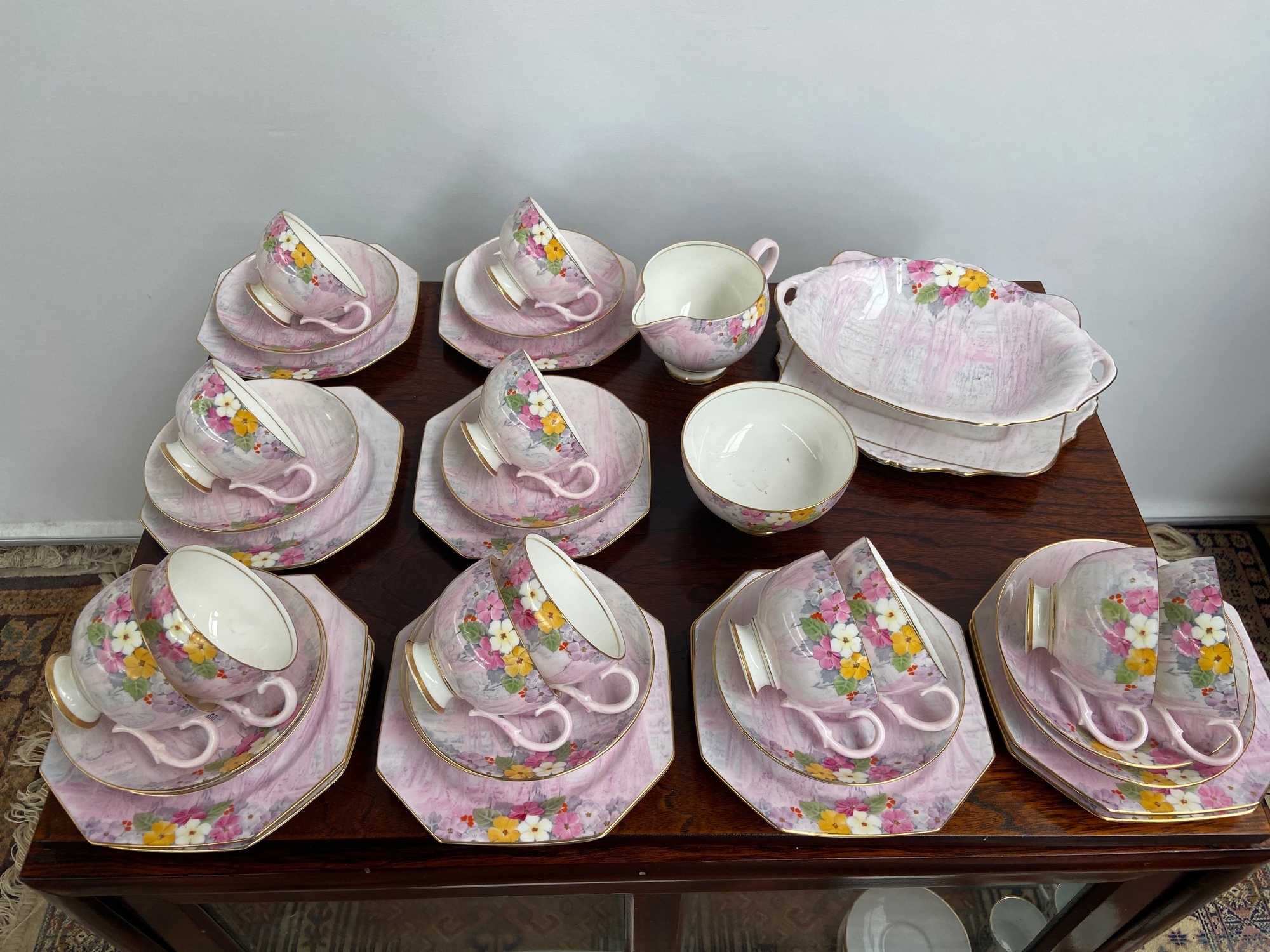 A 40 Piece vintage Paragon floral design tea set. Together with a paragon cake plate.