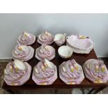 A 40 Piece vintage Paragon floral design tea set. Together with a paragon cake plate.