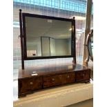 A Georgian mahogany adjustable dressing table mirror upon a three drawer base